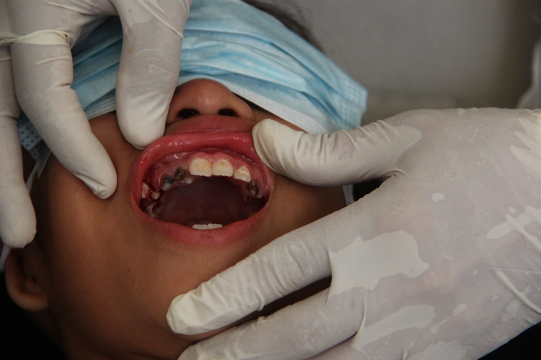 Patient getting her teeth examined during a diagnostic dental visit