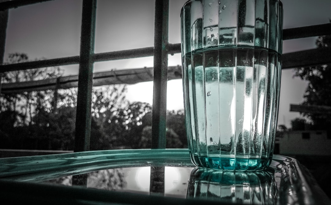 Clear glass of water — hydration is essential for managing dry mouth